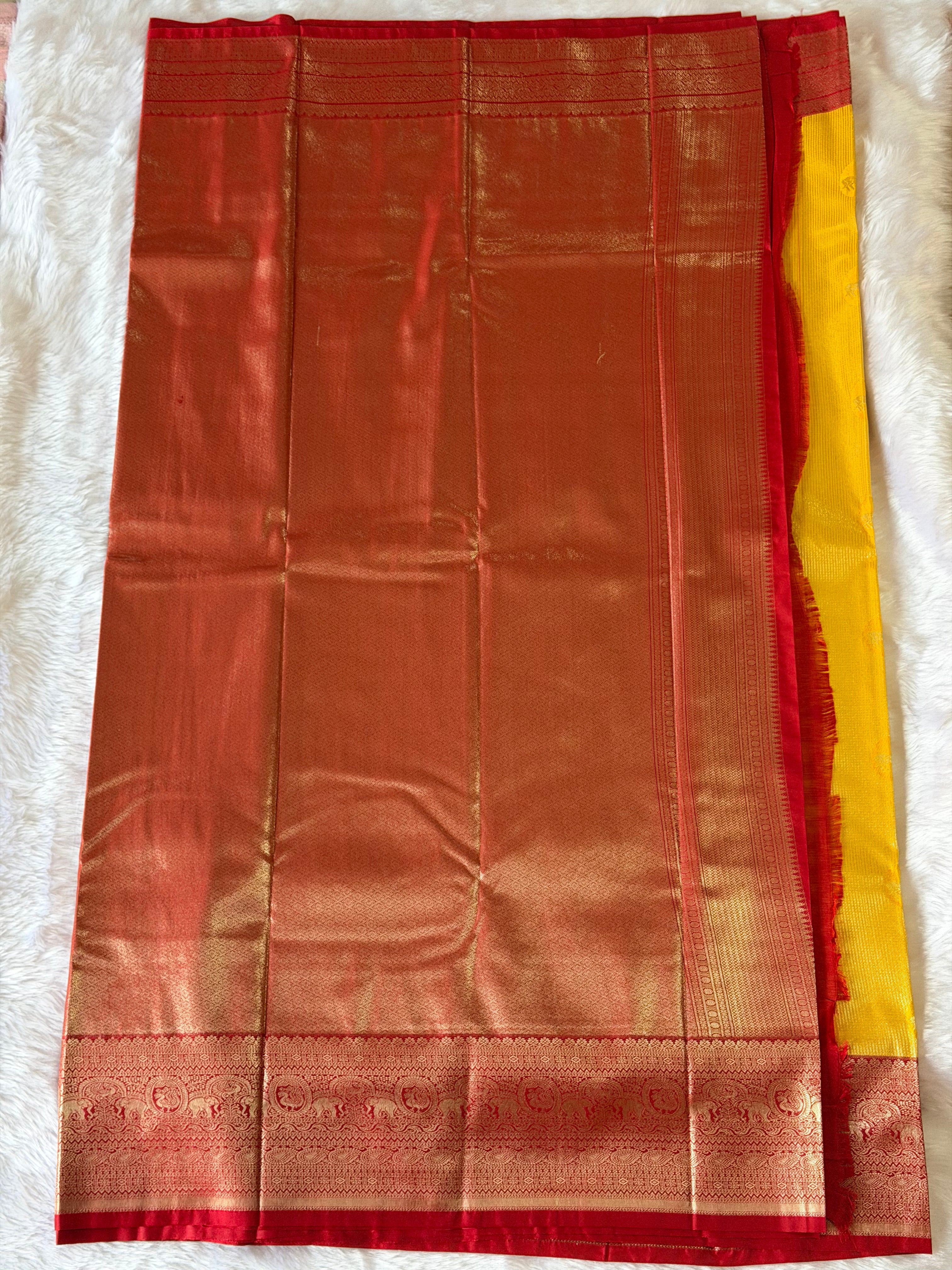 Maroon zari contrast border with wide ornamental motifs on mustard yellow Kanchipuram polyester saree