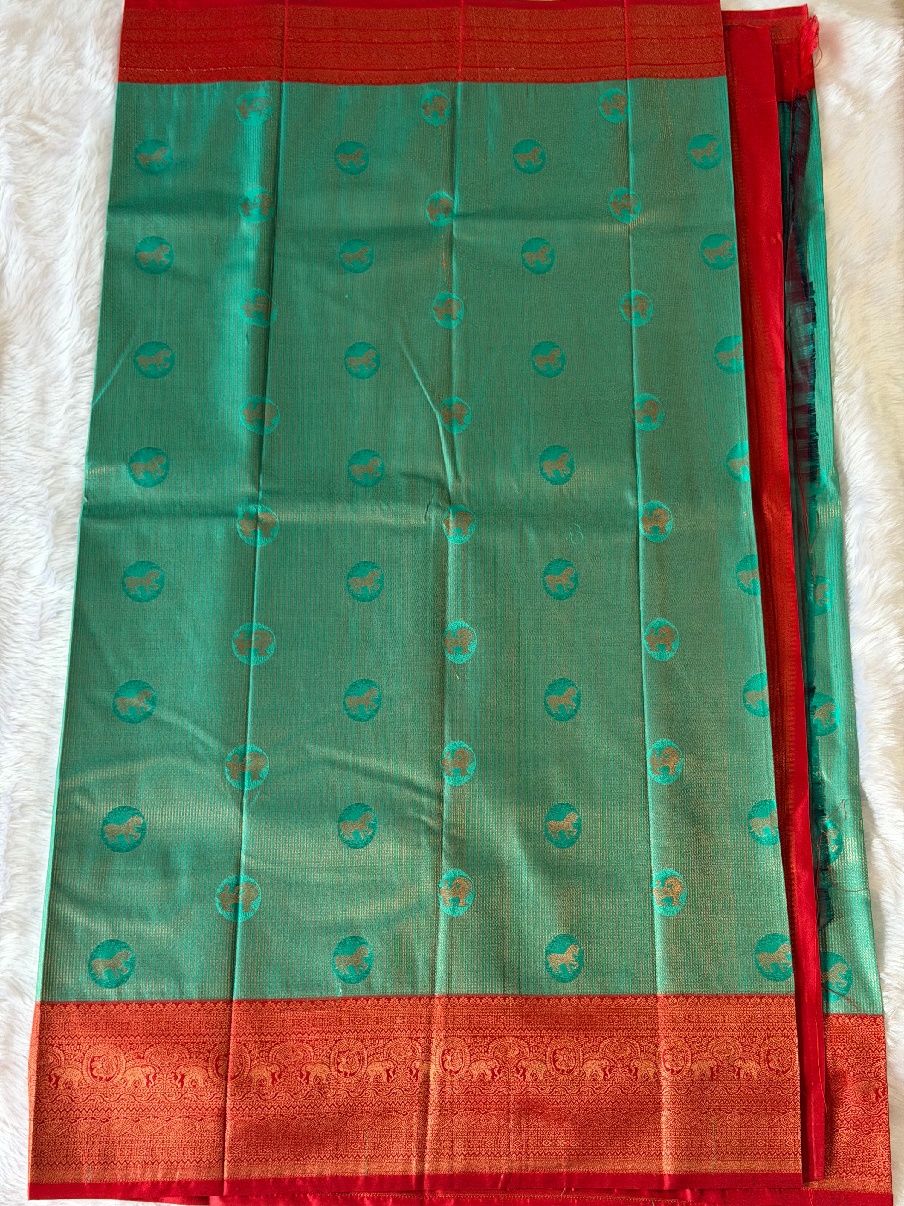 Seafoam green Kanchipuram polyester saree body with circular gold motifs