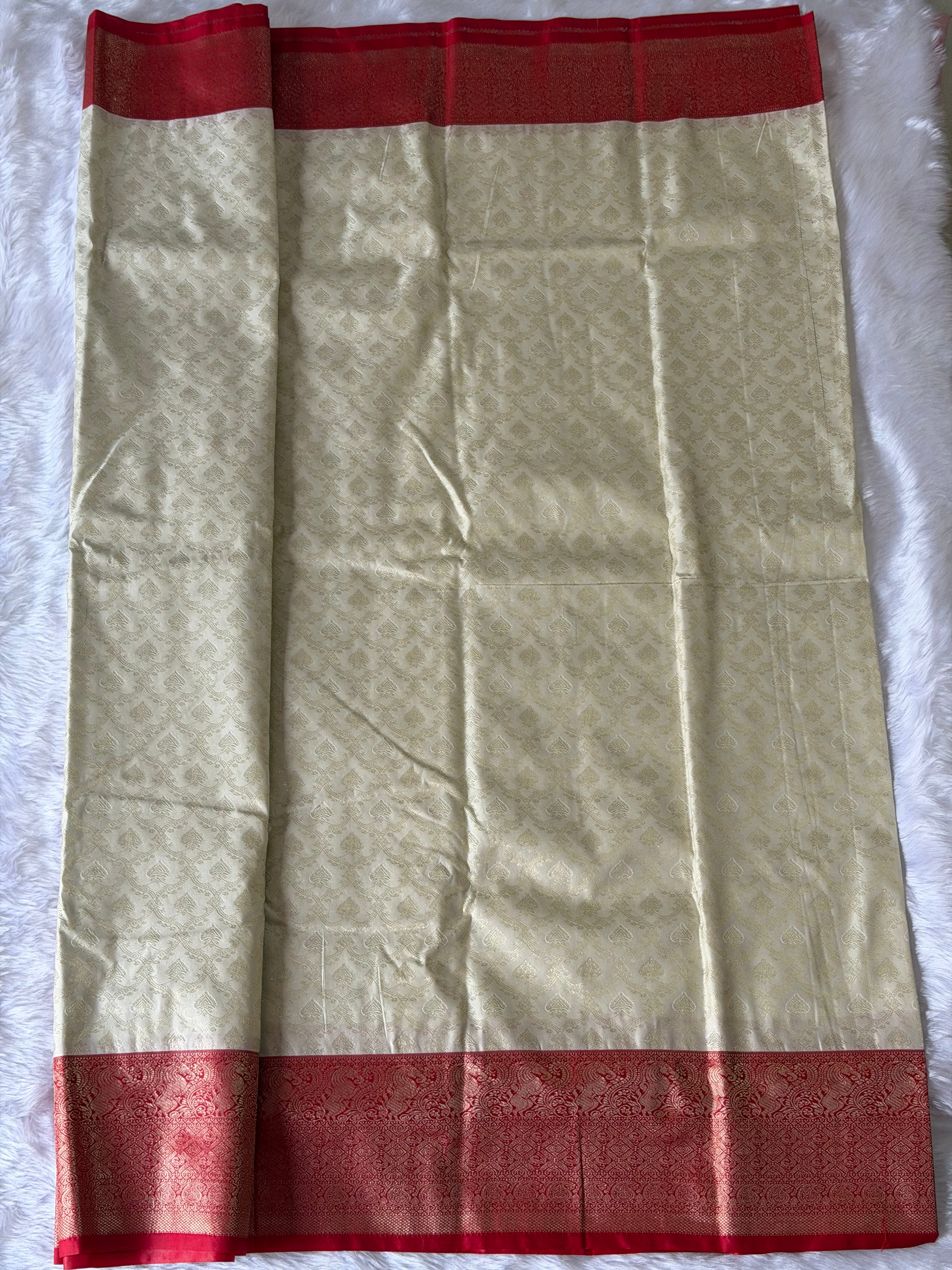 Off-white and red Kanchipuram polyester saree full view - classic South Indian bridal choice