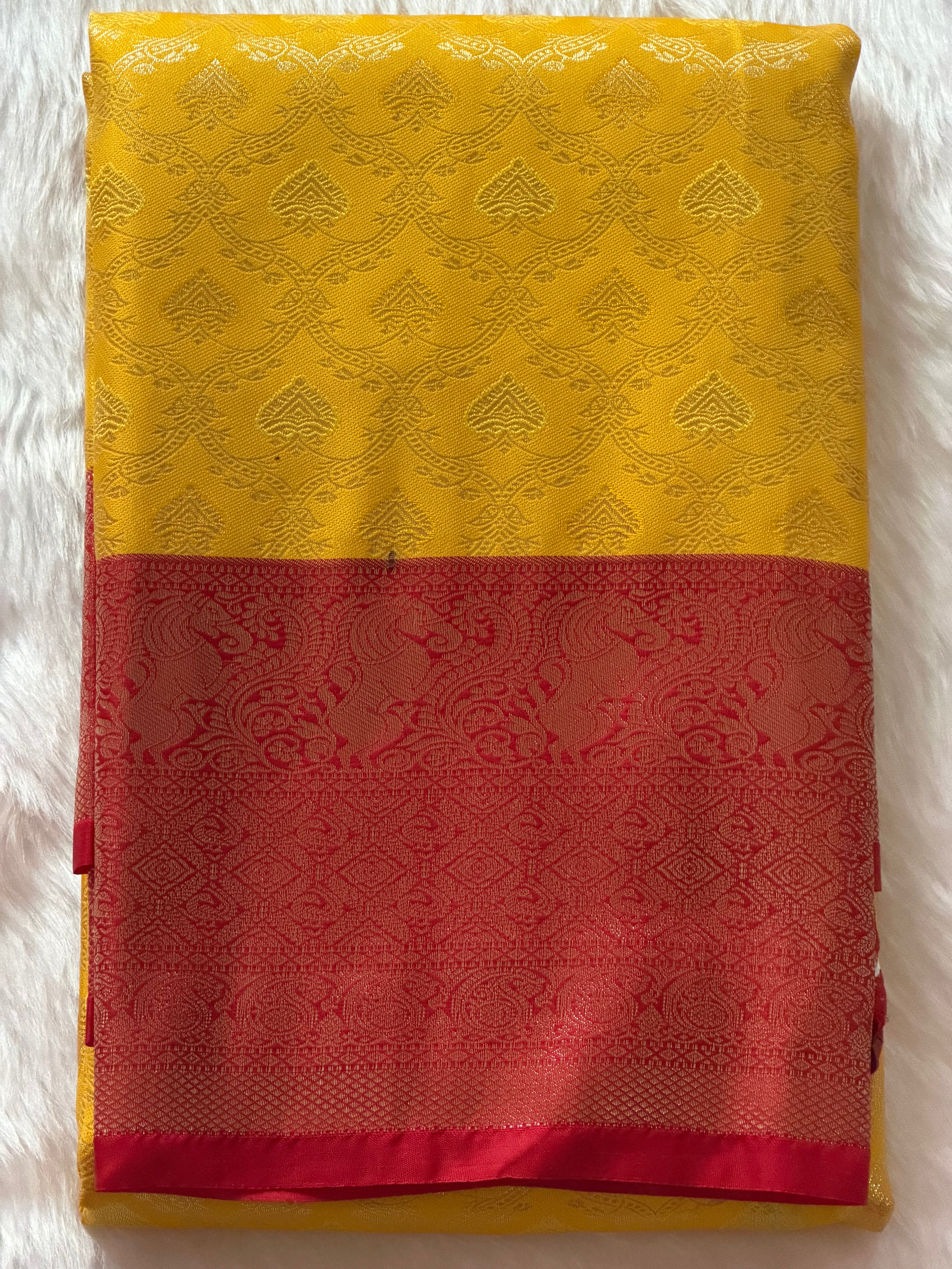 Mustard yellow Kanchipuram polyester saree draped view - vivid colour smooth finish