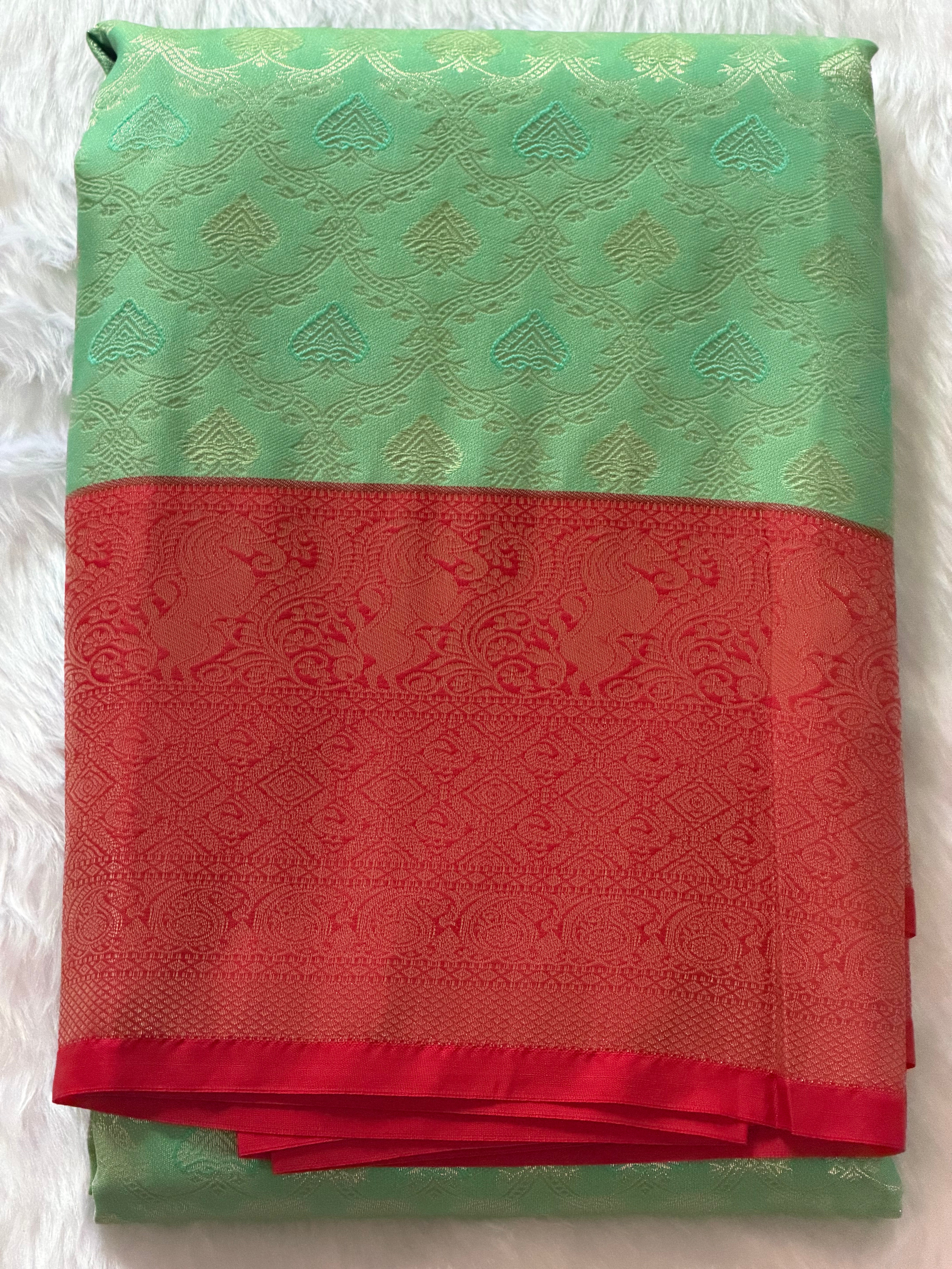 Seafoam green Kanchipuram polyester saree draped view - breezy cool fabric for festivals