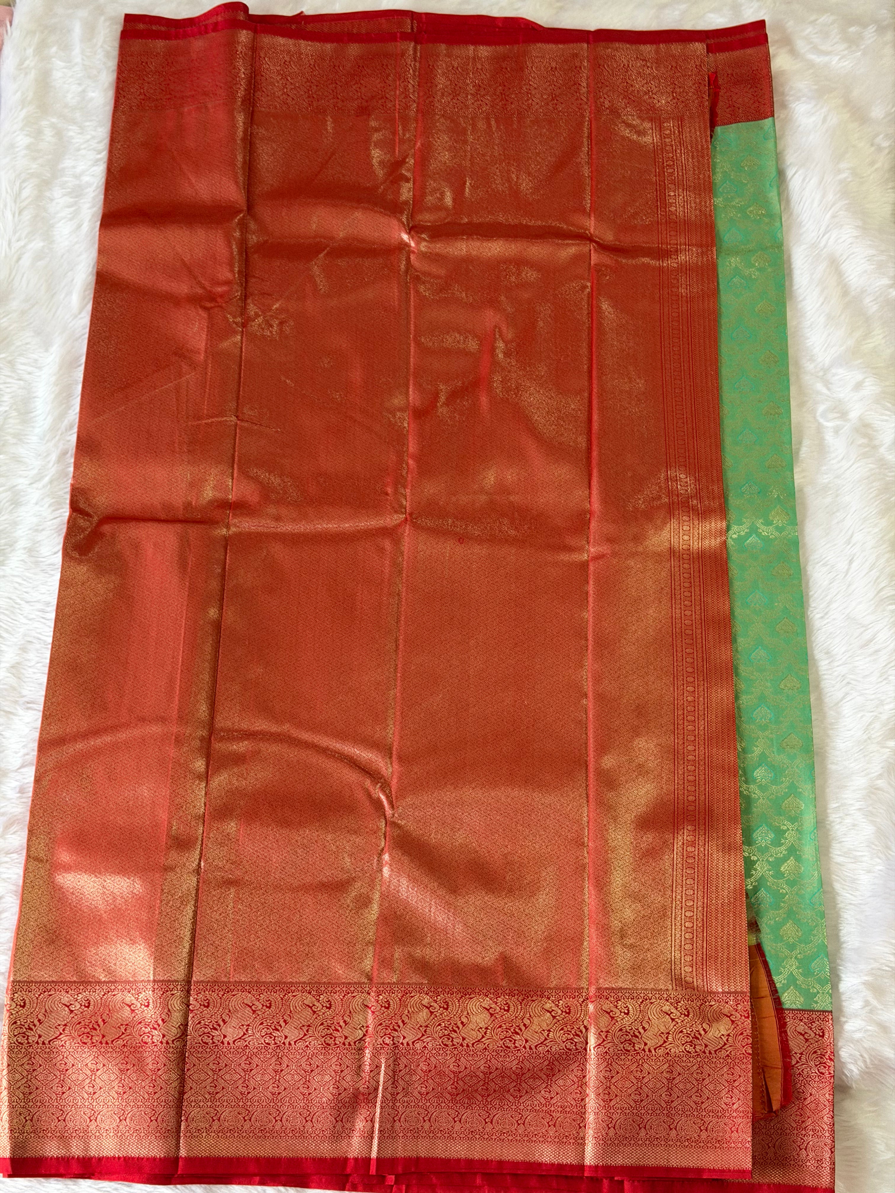 Seafoam green Kanchipuram polyester saree body with delicate gold zari butta motifs