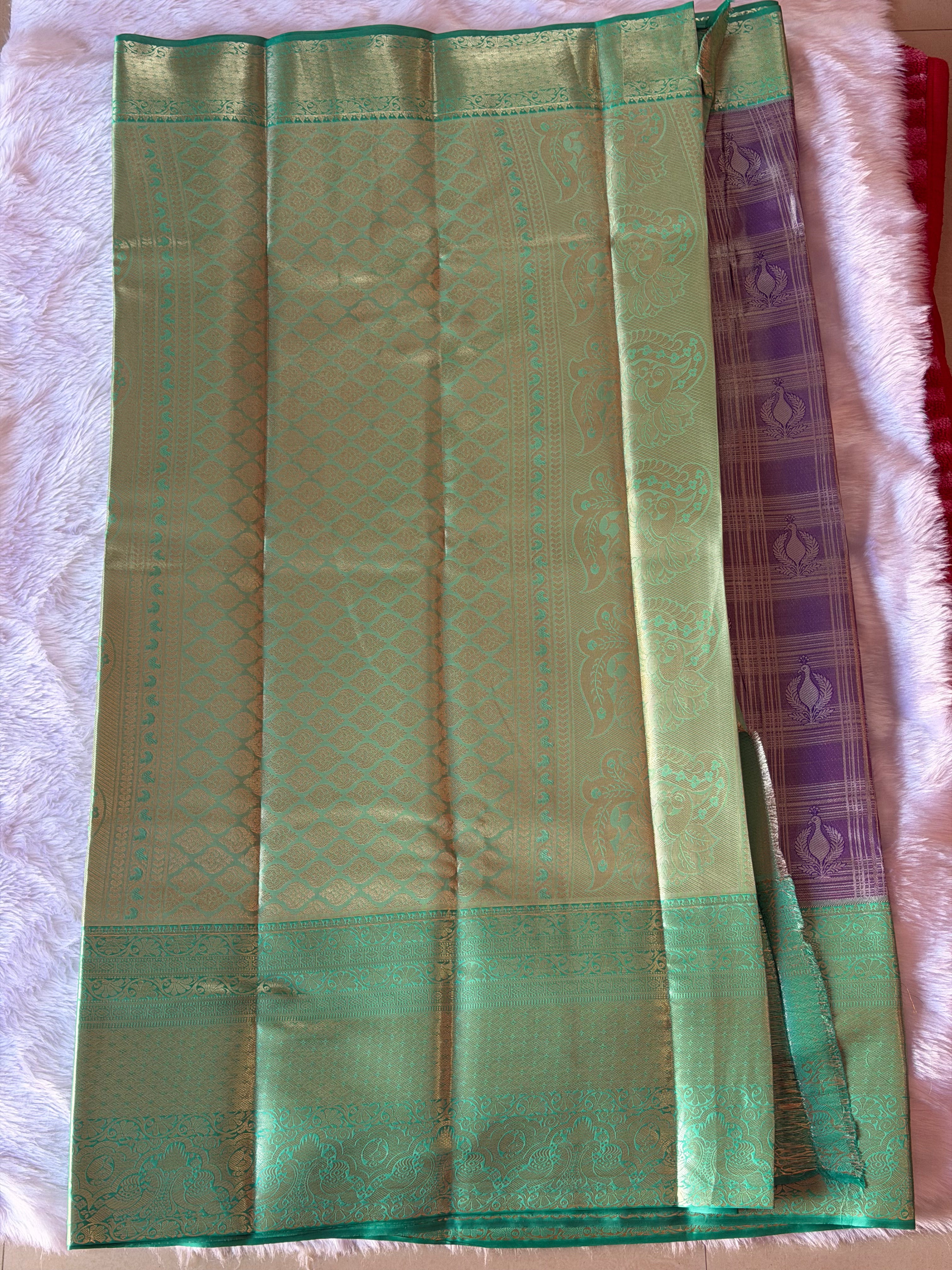 Emerald green Kanchipuram polyester saree body with smooth silk finish