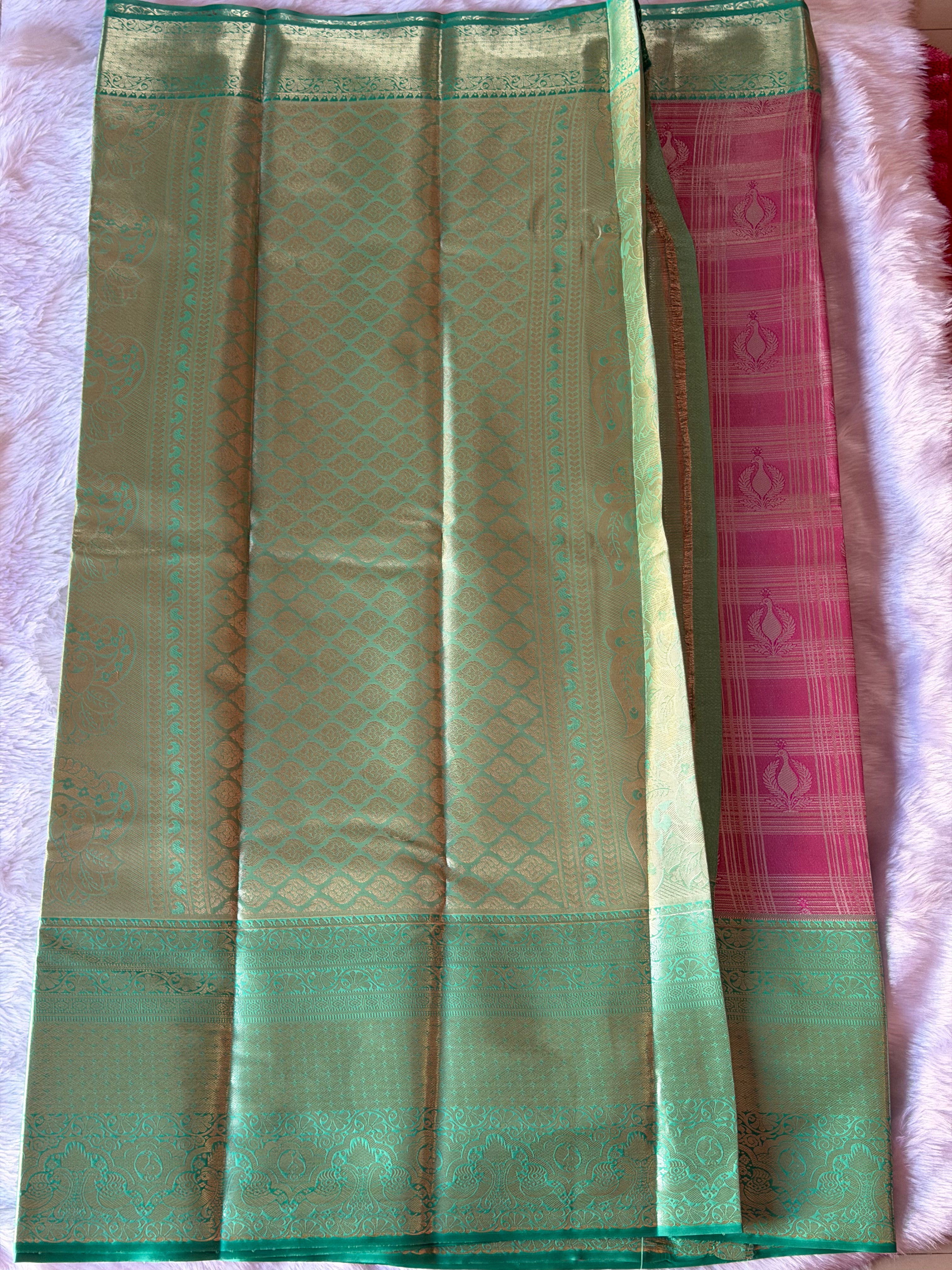 Emerald green Kanchipuram polyester saree body - vibrant colour with smooth lustrous drape