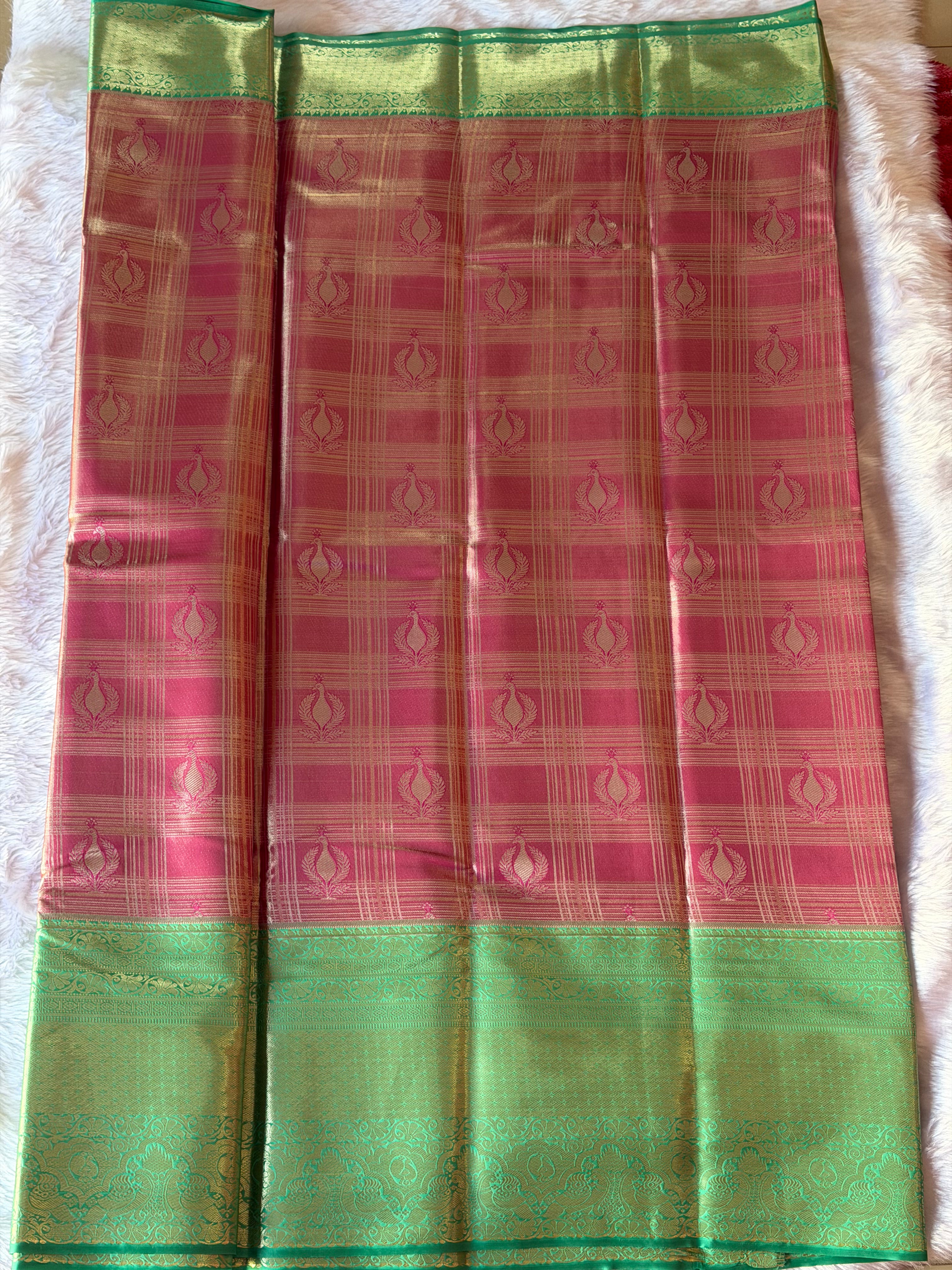 Deep purple contrast border on emerald green Kanchipuram polyester saree