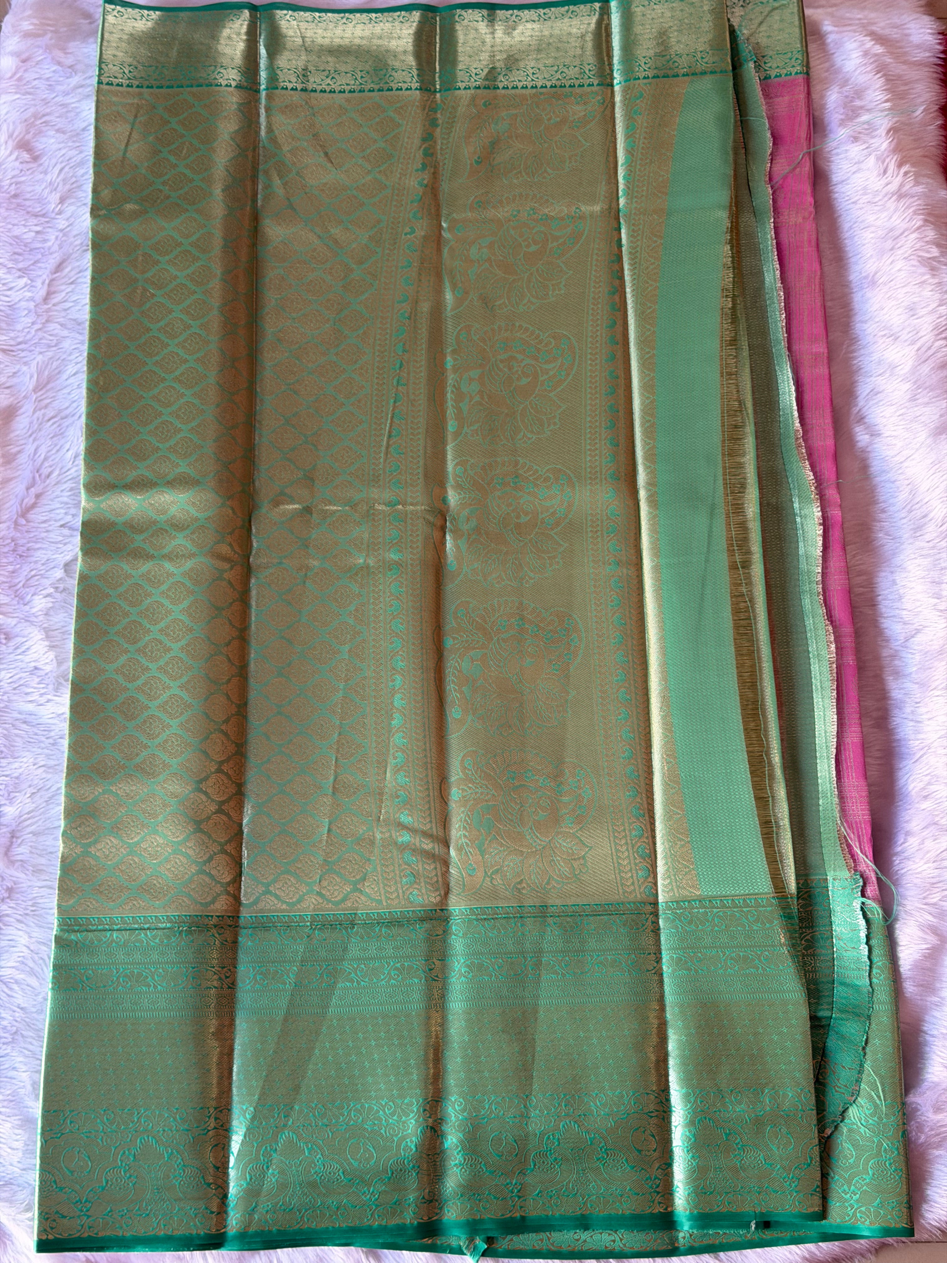 Emerald green Kanchipuram polyester saree body with lustrous polyester silk finish